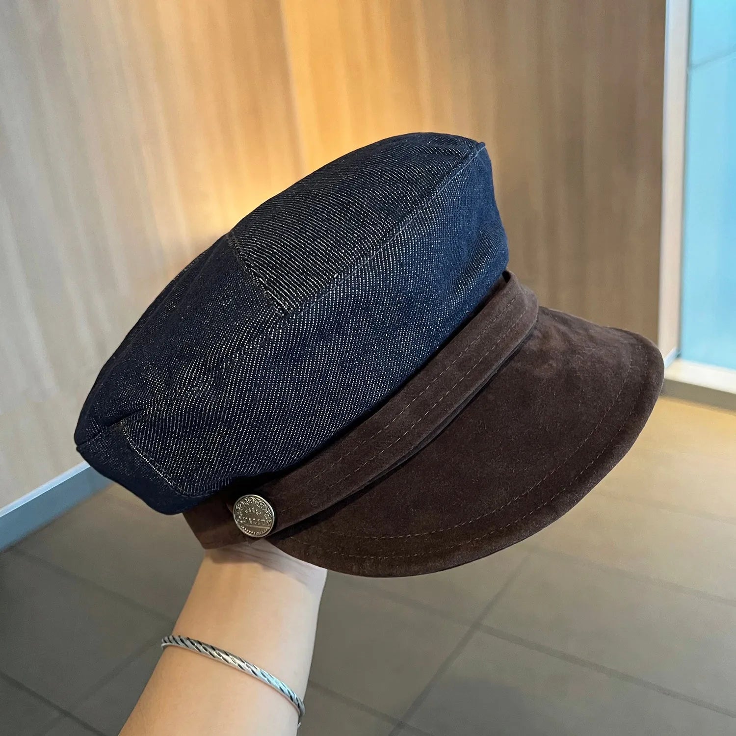 Dark blue denim octagonal newsboy hat with adjustable 54-58cm sizing and colour accent brim options