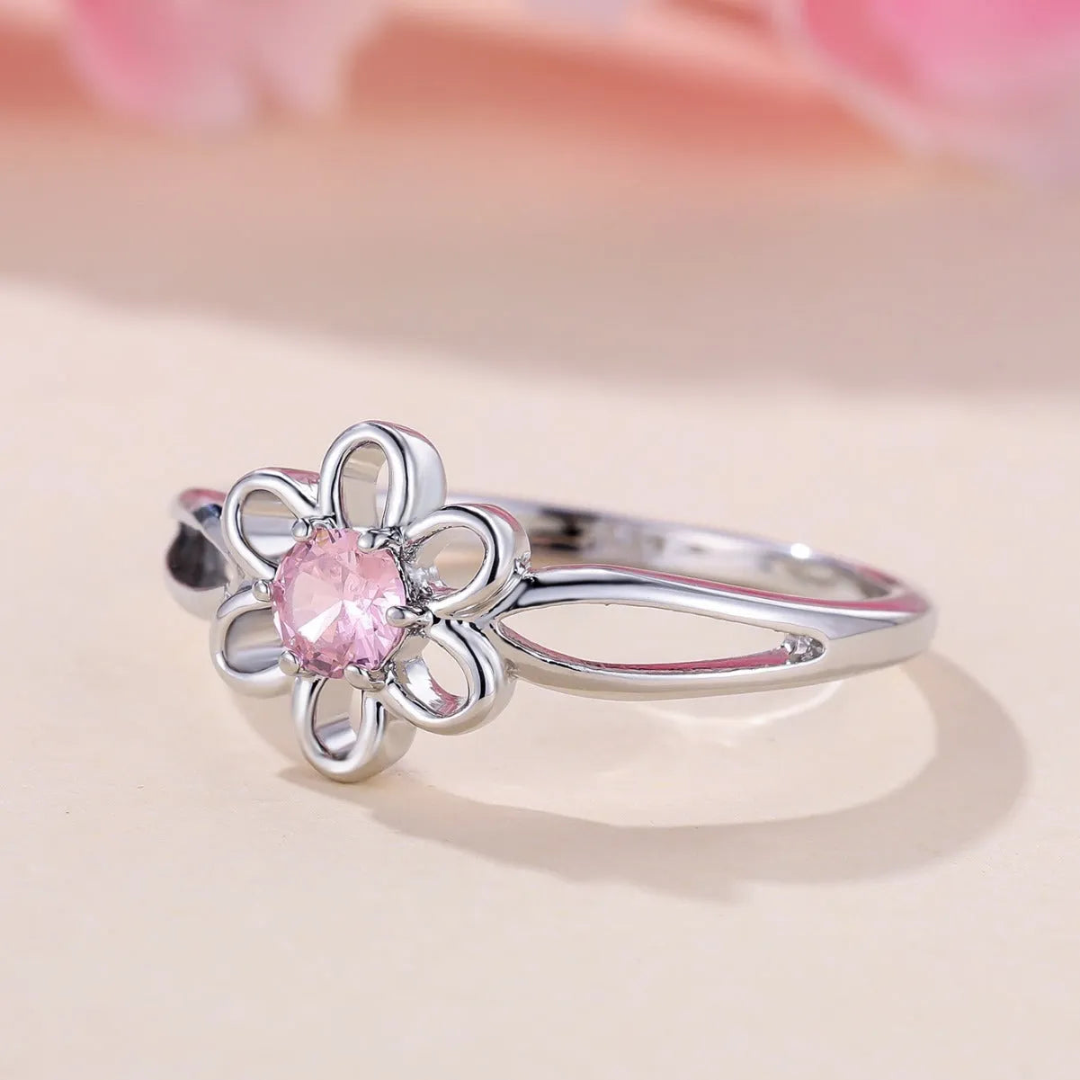 Women's hollow floral fashion ring in electroplated copper with a choice of metallic finishes.
