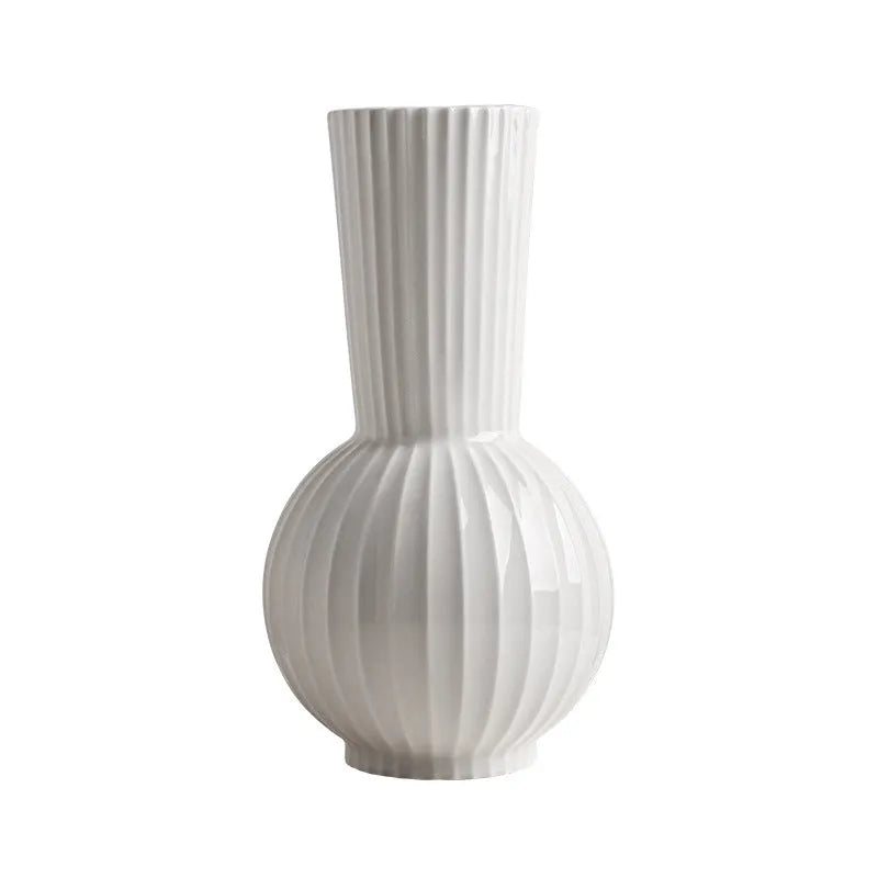 White ceramic ball vase with striped patterning in American country style on wooden table