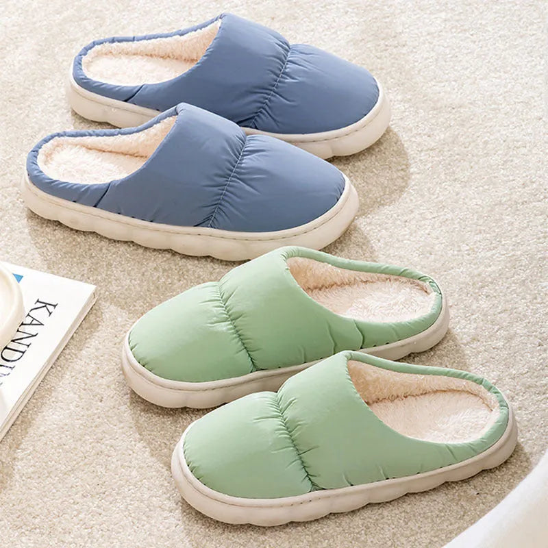 Down cotton winter slippers with artificial leather upper, thick rubber sole, and plush lining in blue colour