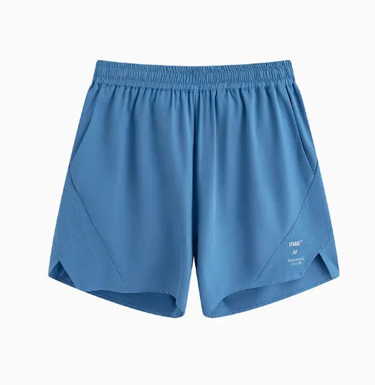 Black and blue four-point running shorts with laser punching stitching details on a mannequin.