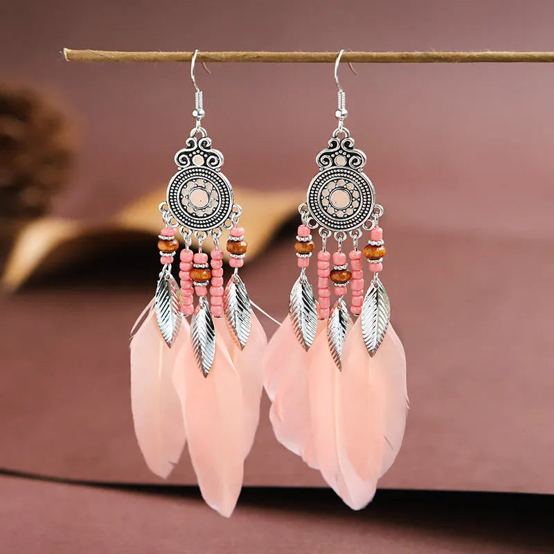 Round drop feather design alloy earrings with leaf pattern in a bohemian style, showing electroplated finish.