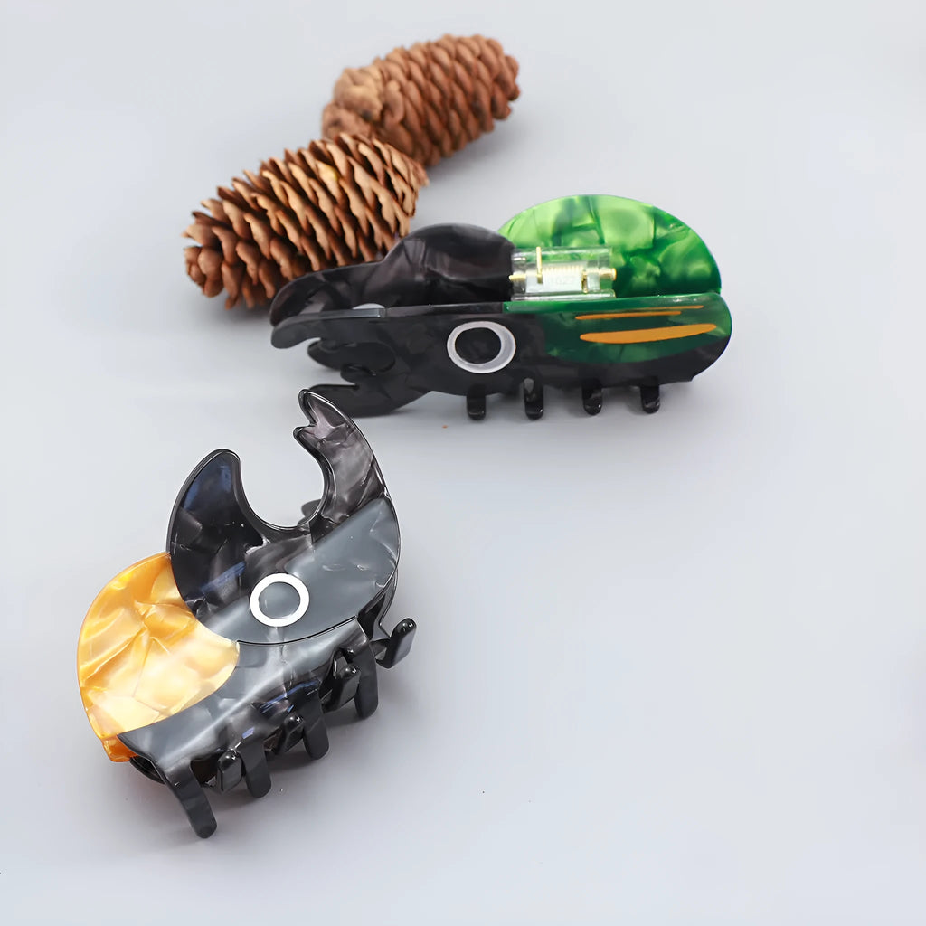 Handmade cellulose acetate insect beetle grip desk accessory with cartoon caterpillar design