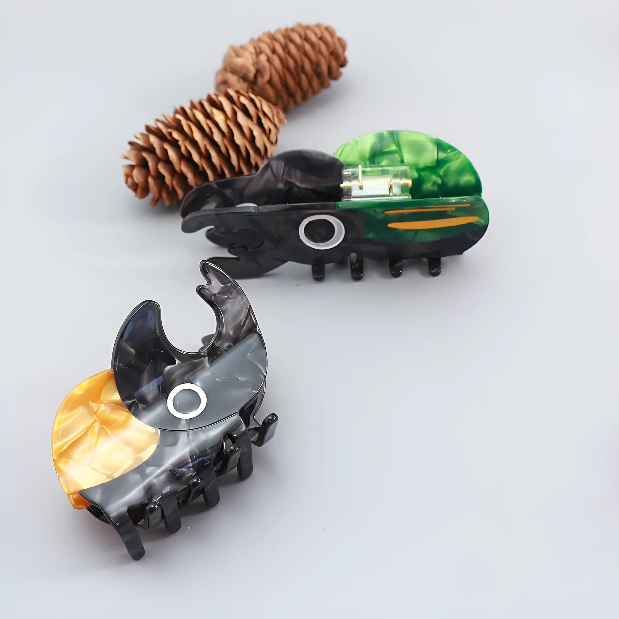 Handmade cellulose acetate insect beetle grip desk accessory with cartoon caterpillar design