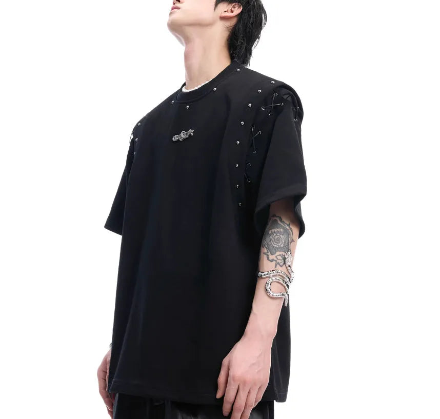 Short sleeve black top with a white lace-up cutout detail on the front, deconstruction style.