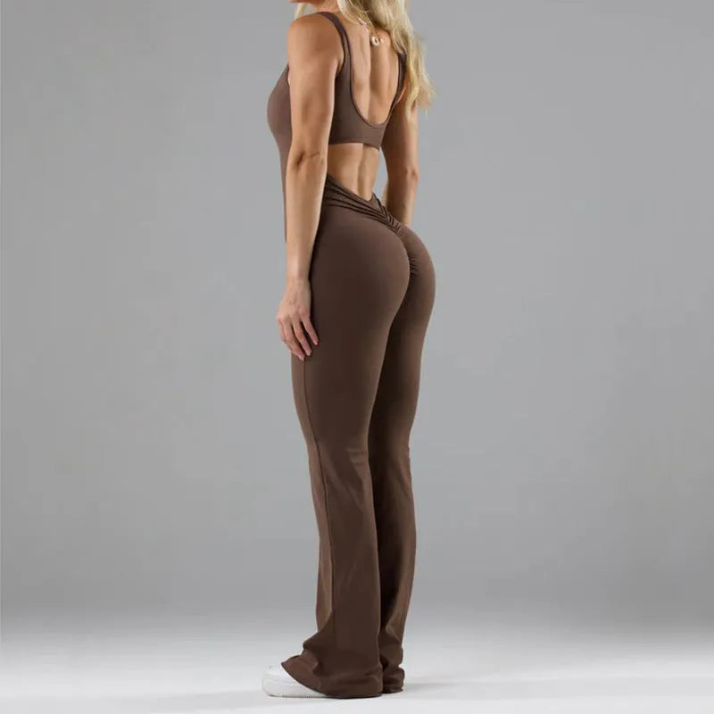 Black women's tight seamless yoga bodysuit with a mid waist and trousers length.