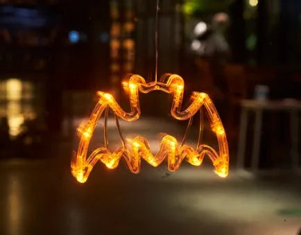 Seven Halloween LED window lights with spider, pumpkin and ghost designs on suction cups
