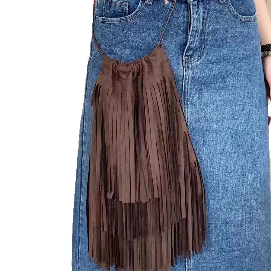 Maroon drawstring beaded tassel crossbody bag with soft plush exterior and single shoulder strap
