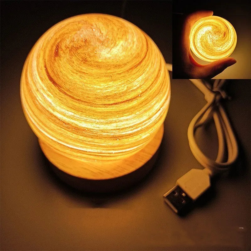 Planet night light with USB cable and base in modern simple design showing spherical shape