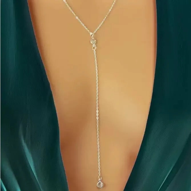 Alloy O-ring chain necklace with geometric pendant in gold finish on female neckline