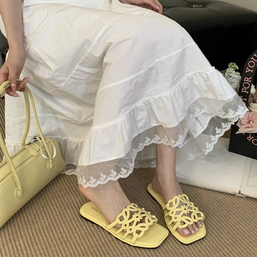 Summer Roman style hollow-out flat beach slippers for women in black