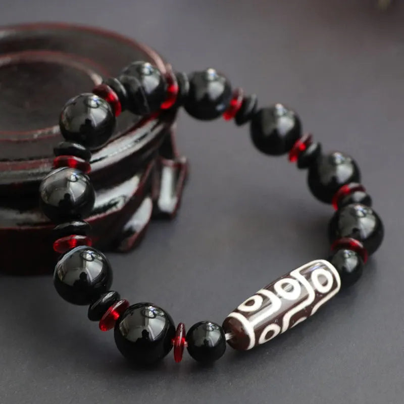 Black agate Dzi bead bracelet with hand-woven geometric pattern in national style design