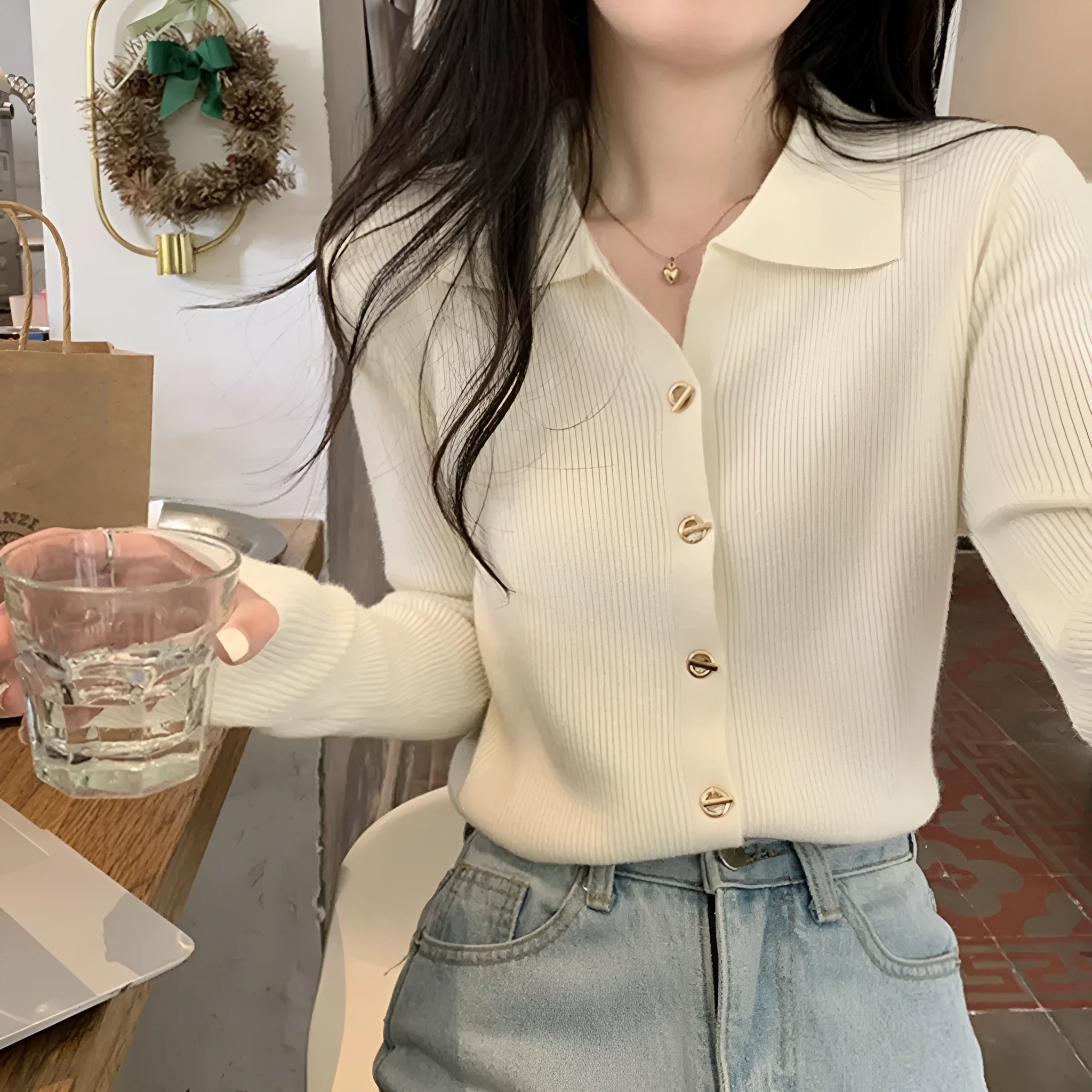 Women's beige loose-fit long-sleeved viscose knitted cardigan shown open as a layering piece.