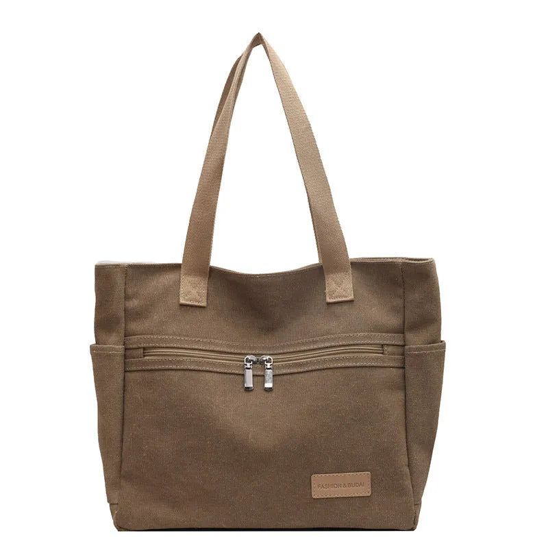 Canvas shoulder bag for women with contrast stitching and double shoulder straps, available in grey