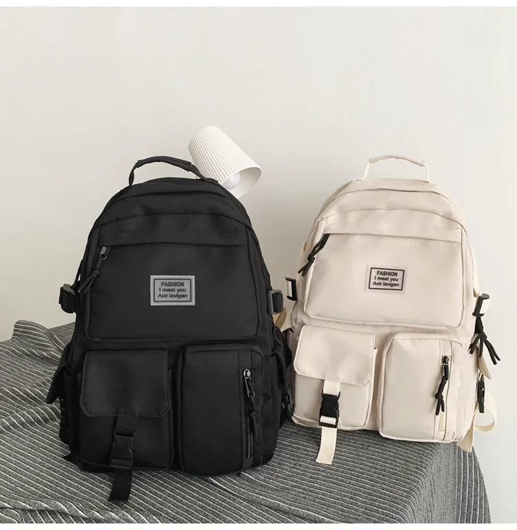Black nylon student backpack showing laptop compartment and three-dimensional pockets