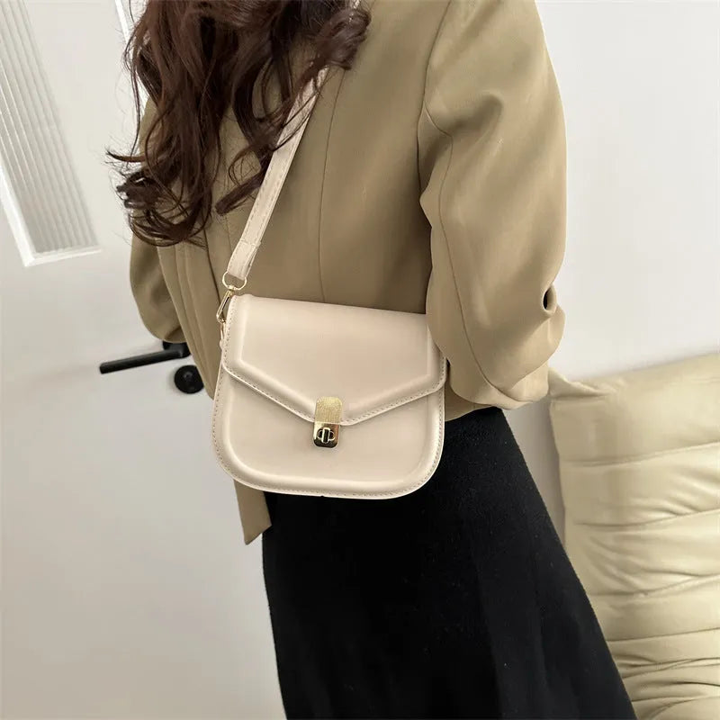 Unisex PU leather clamshell shoulder messenger bag in horizontal square design with adjustable strap