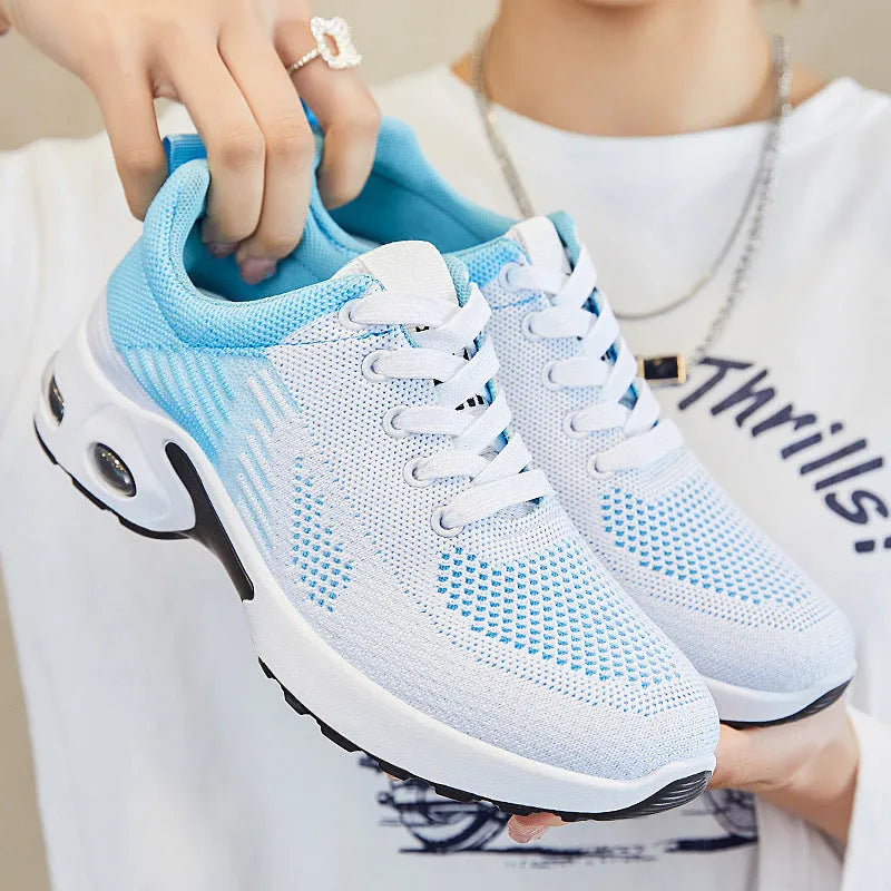 Women's Flyknit casual running shoes in a stripe pattern, showing front lace-up and round toe design.