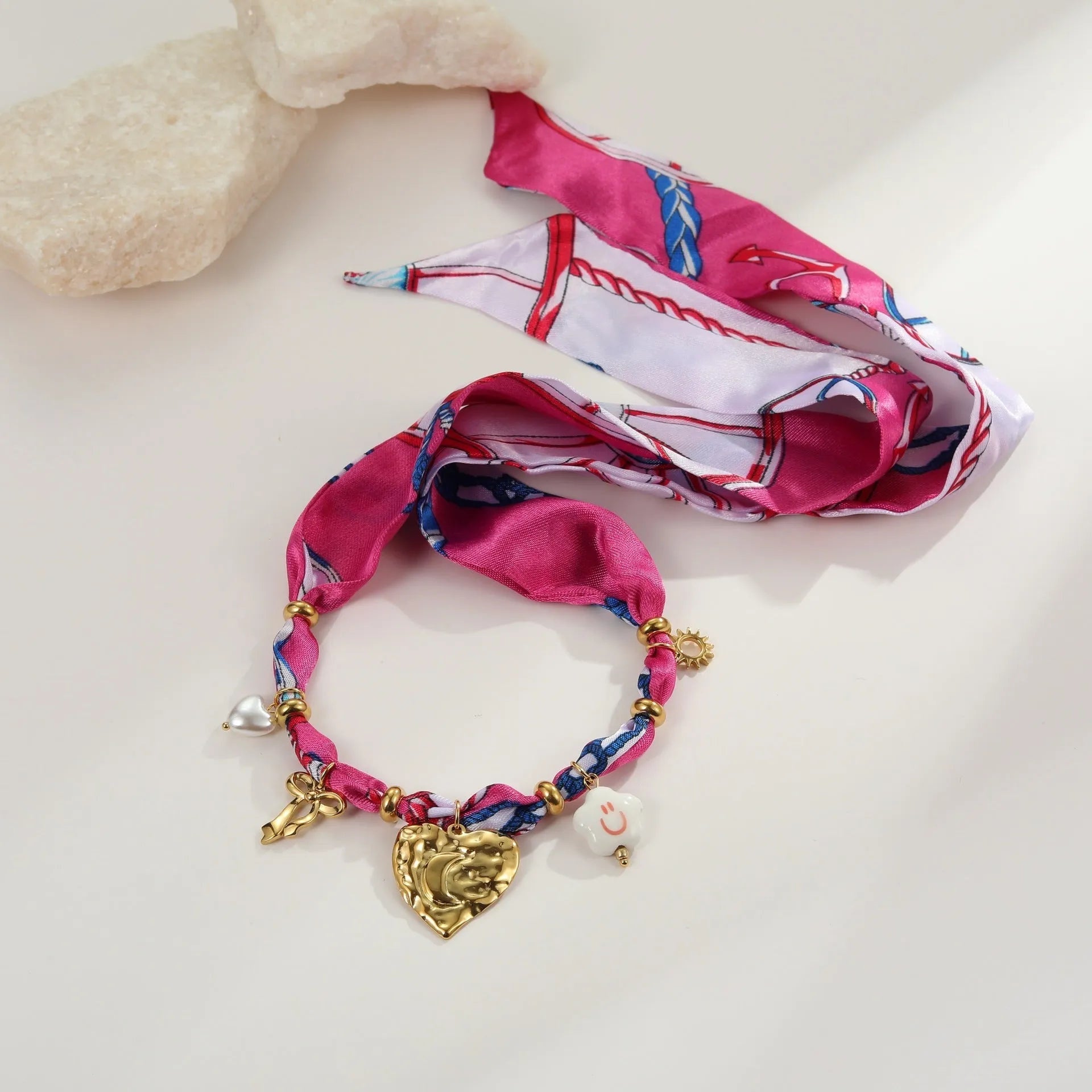 Gold geometric necklace and bracelet set with stainless steel construction and matching pendant designs
