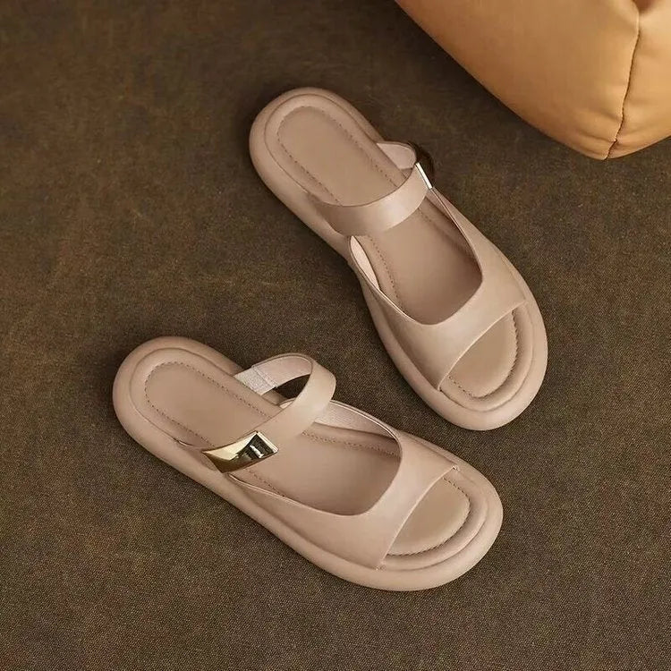 Women's apricot peep toe flat platform sandals with a leather upper and rubber sole.