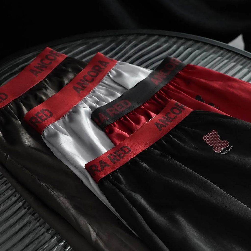 Men's solid colour boxer briefs on a mid waist mannequin showing the polyester knit fabric.