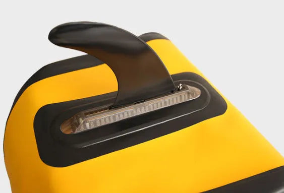 SUP paddle with large removable plastic fish fins attached, shown as a paddleboard accessory.
