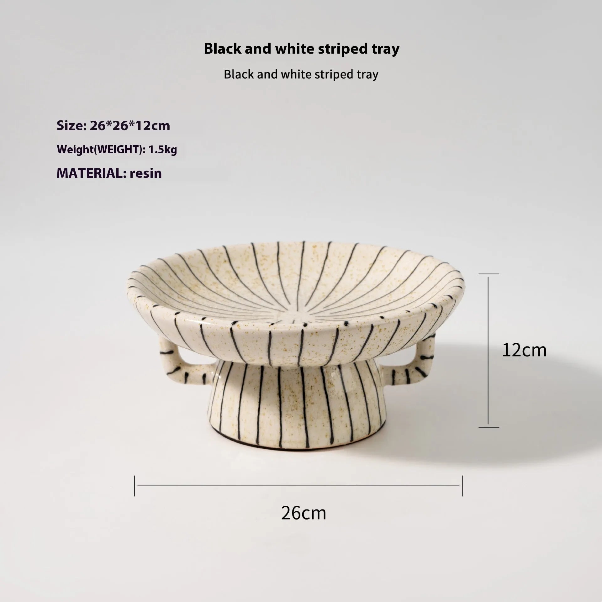 Black and white striped synthetic resin fruit plate or dessert plate on a table