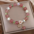 Double layer strawberry quartz bracelet with lucky cat charm and red cat's eye flowers