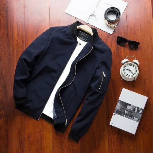 Men's slim fit casual baseball jacket with zipper closure and side pockets in a solid colour.