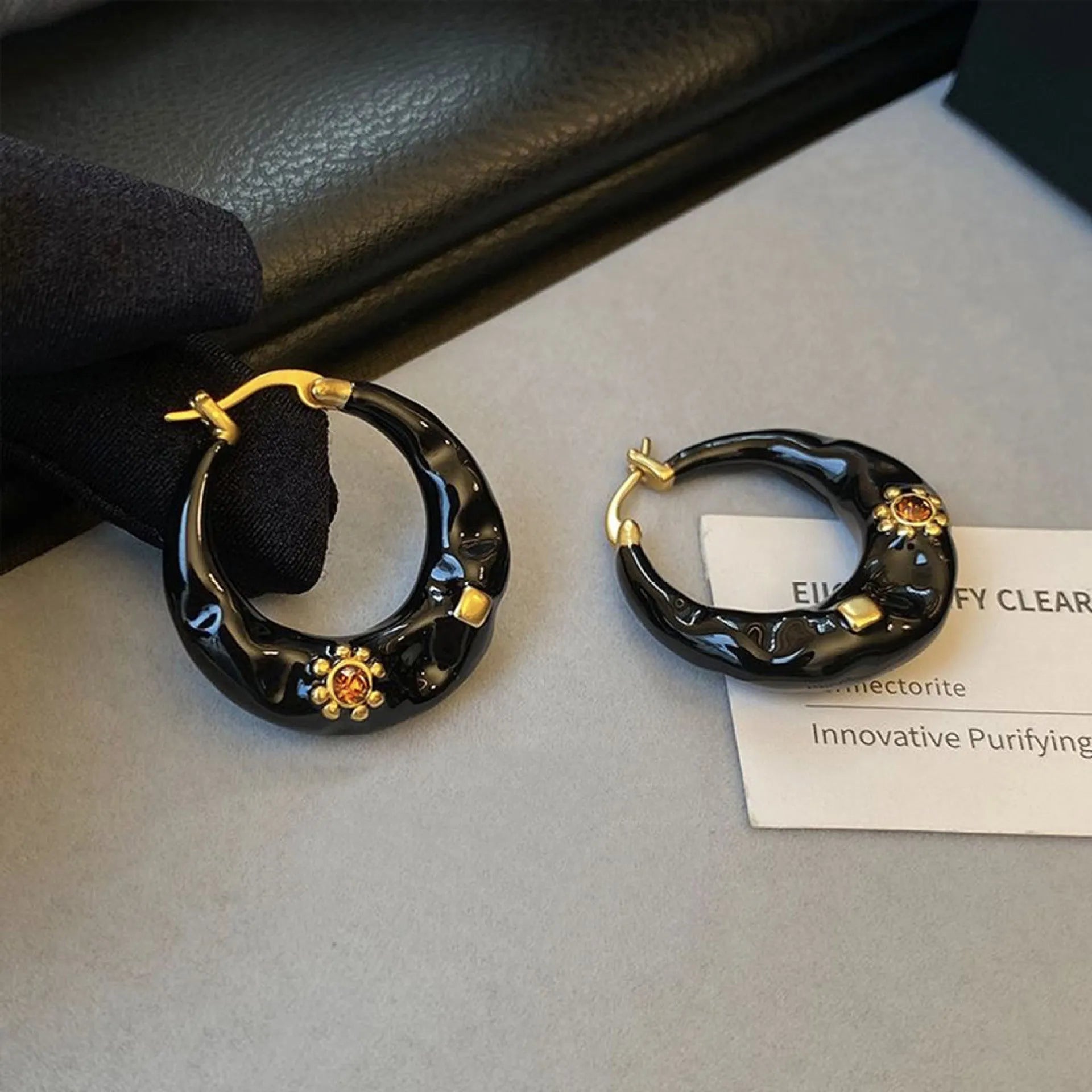 Hong Kong style retro ear studs with dripping oil finish and rhinestone inlay in black and red colours