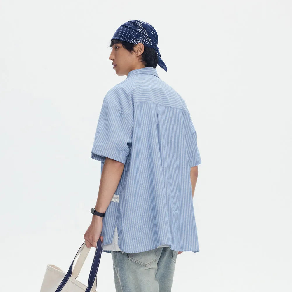 Blue striped short-sleeved overall shirt with cardigan opening and cotton blend fabric