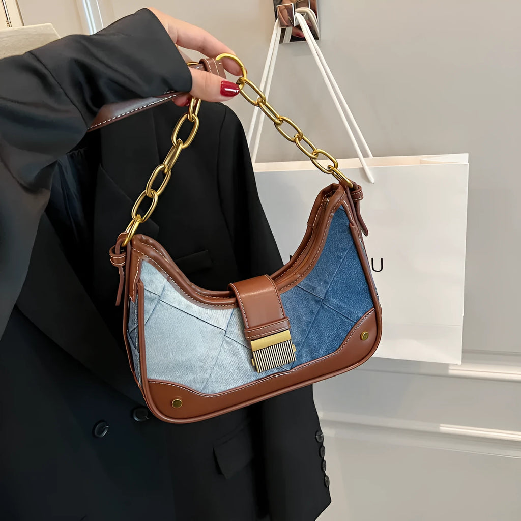 Women's brown denim shoulder bag with diamond chain accents and bucket shape design