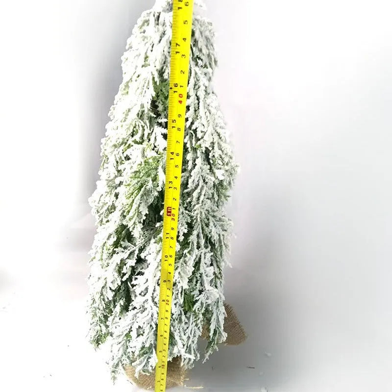 Small 24-inch white Christmas tree with lights and snow-covered branches for desktop decoration