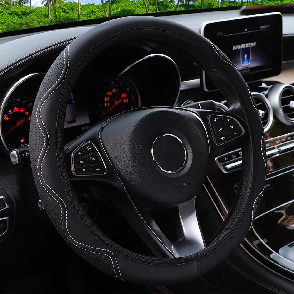 Black elastic steering wheel cover with corrugated texture, stretched to show fit on a 37-38cm wheel.