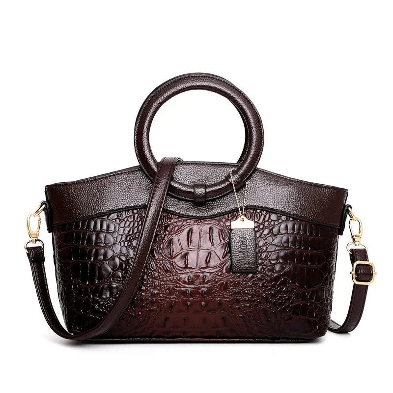 Fabric ladies casual handbag showing multiple compartments including zipper pocket and phone bag