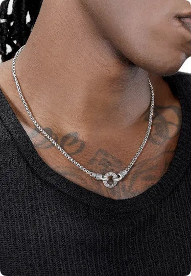 A sterling silver clavicle necklace for women with a minimalist pendant on a delicate chain.