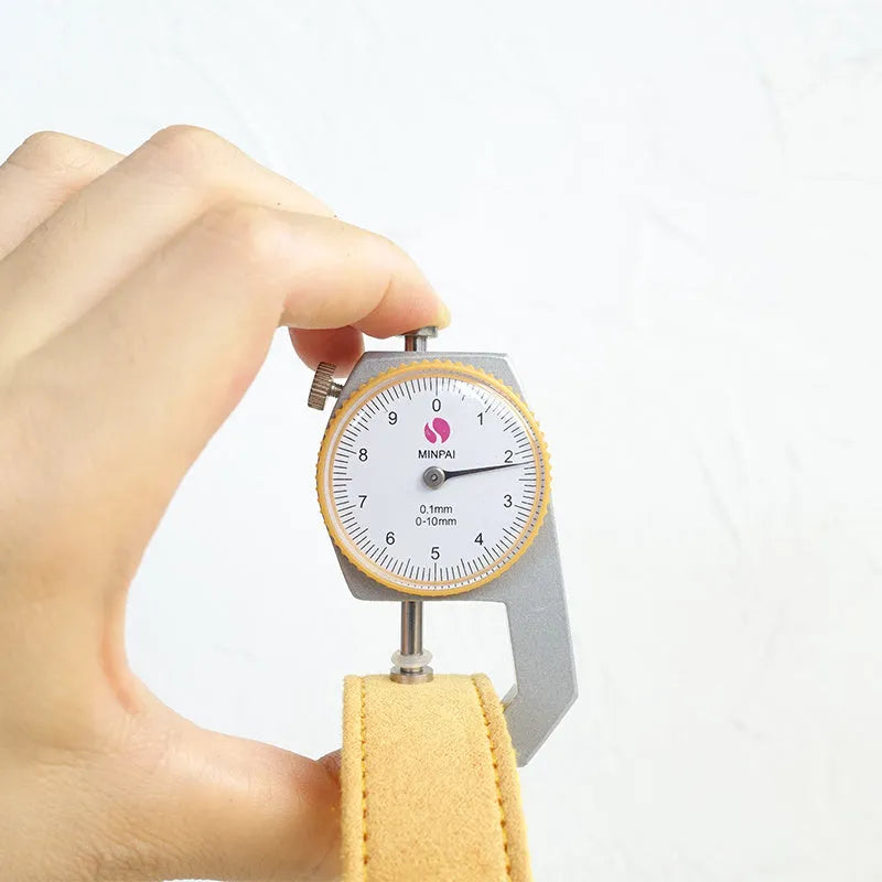 Yellow velvet polyester adjustable dog collar on a light background showing buckle and sizing details.