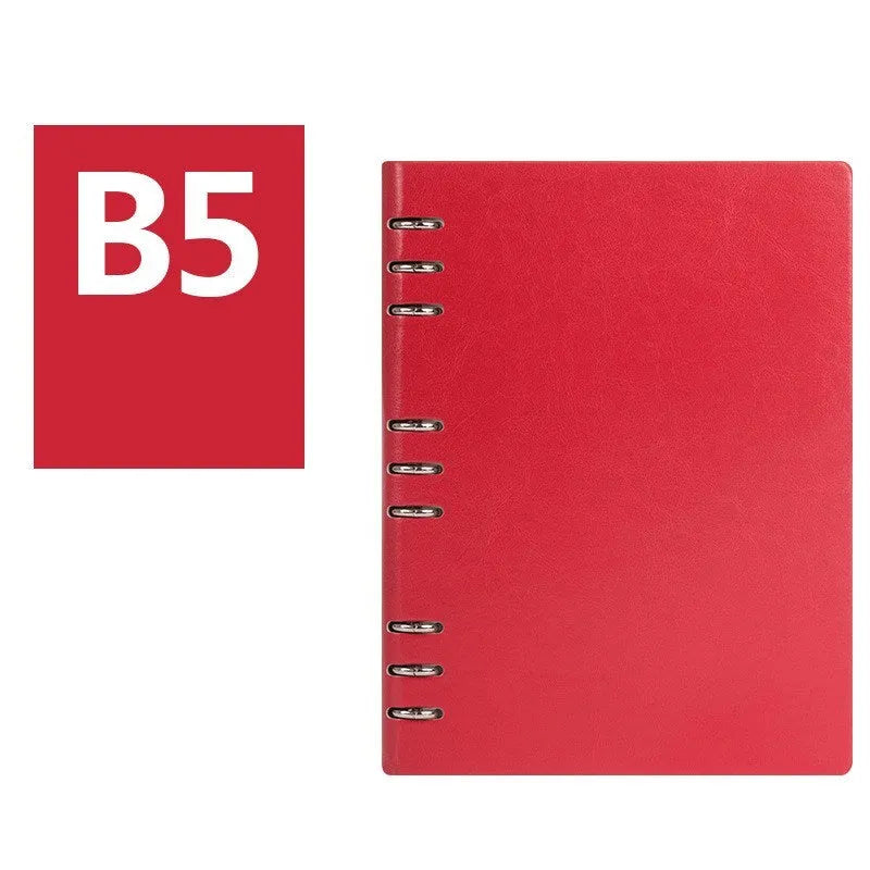 Simple business notebook with imitation leather cover showing loose-leaf binding and beige road forest paper