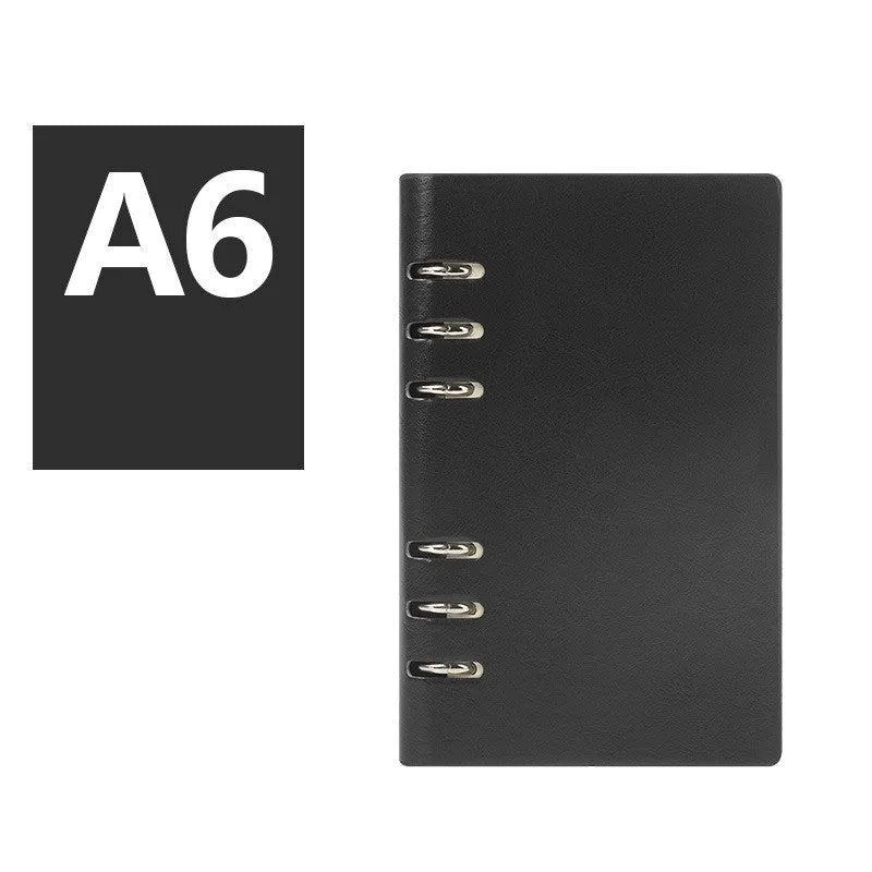 Simple business notebook with imitation leather cover showing loose-leaf binding and beige road forest paper