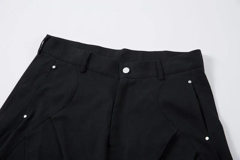 Black men's loose-fitting cotton pleated trousers with a wide-leg casual style.