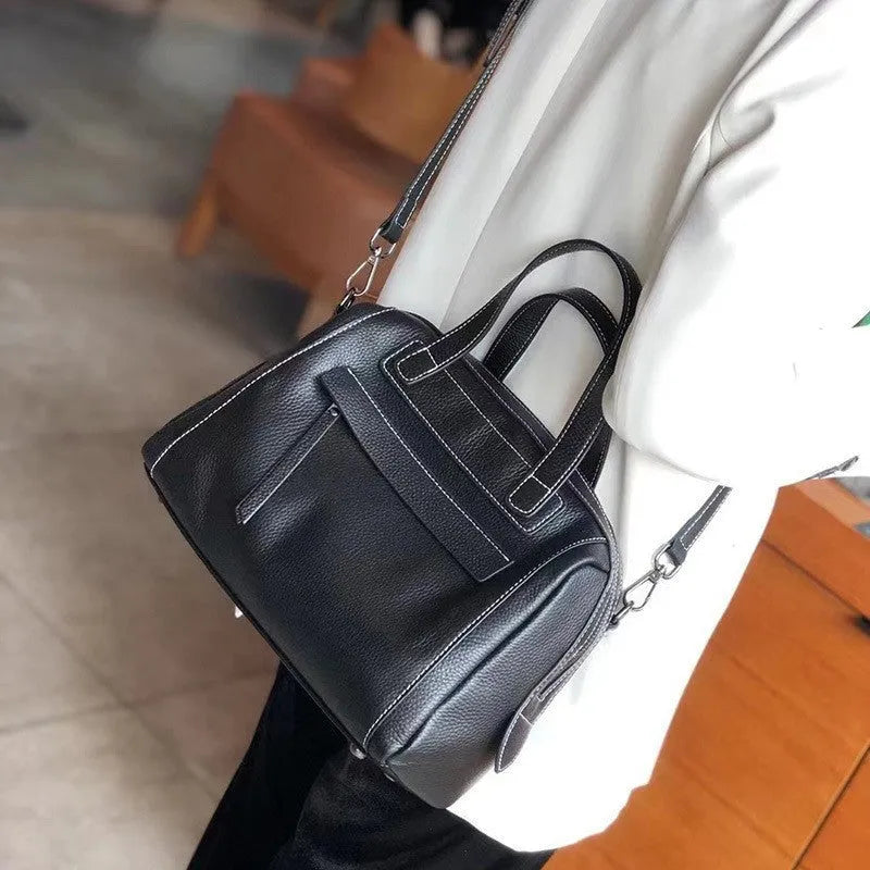 Genuine leather messenger bag with Boston lychee pattern stitching showing horizontal square shape and shoulder strap