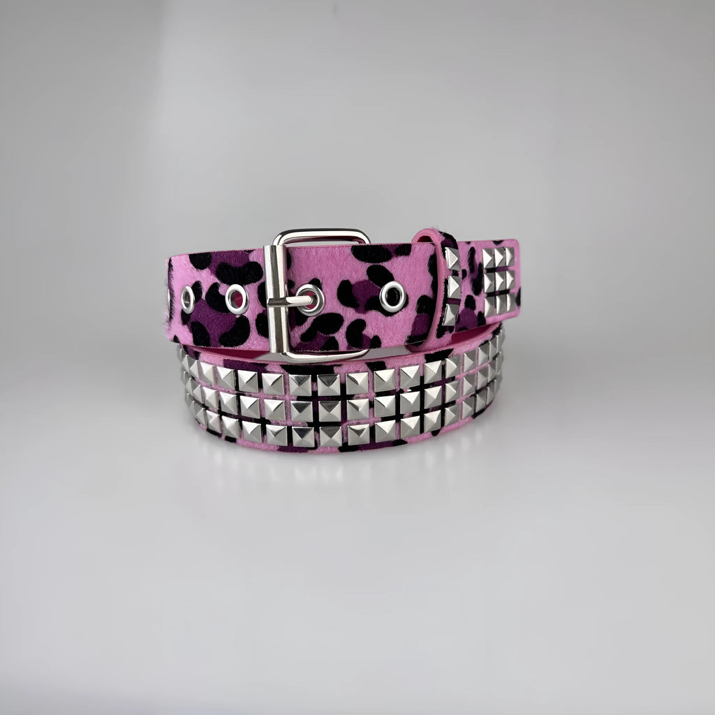 Women's punk fashion belt with metal pyramid studs in leopard print pattern, showing alloy buckle and PU leather strap.
