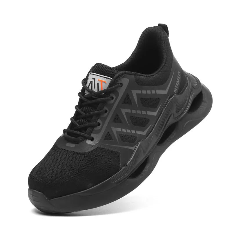 Black low-top safety shoes with a lace-up front, knitted upper, and a visible rubber sole with steel toe cap protection.