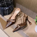 Women's mid heel sandals with patent leather cross strap and buckle closure in caramel colour