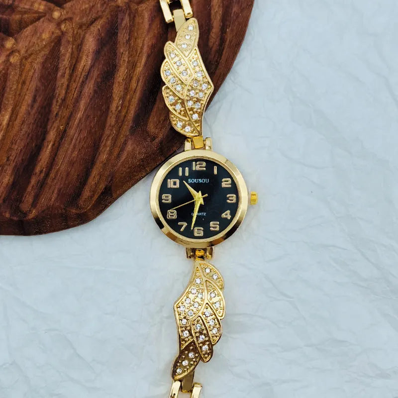 Stainless steel women's watch with round dial on a wrist, showing the Vachette clasp buckle.