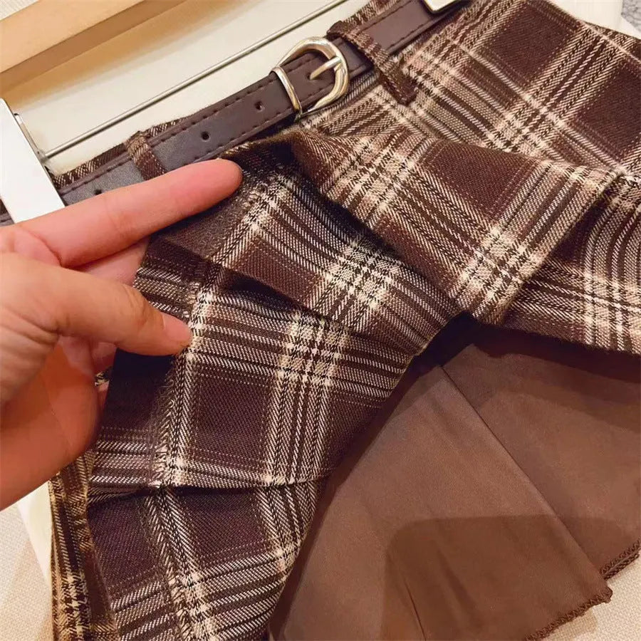 Girls plaid pleated A-line skirt in cotton blend fabric shown in casual setting