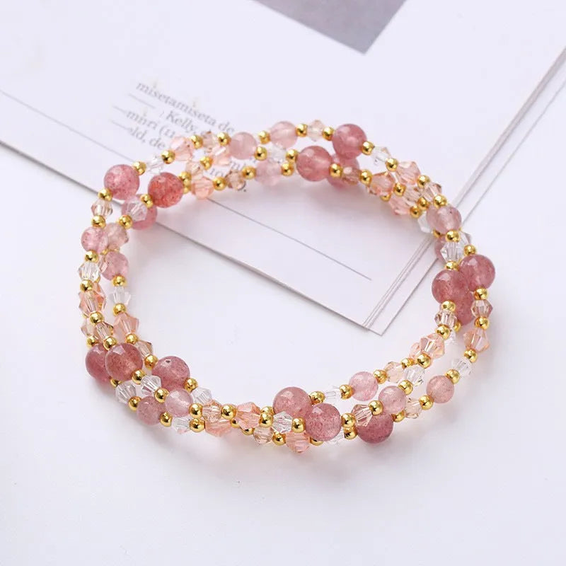 Women's adjustable three-ring bracelet with colourful tourmaline, strawberry quartz, and amethyst crystals on a cord.