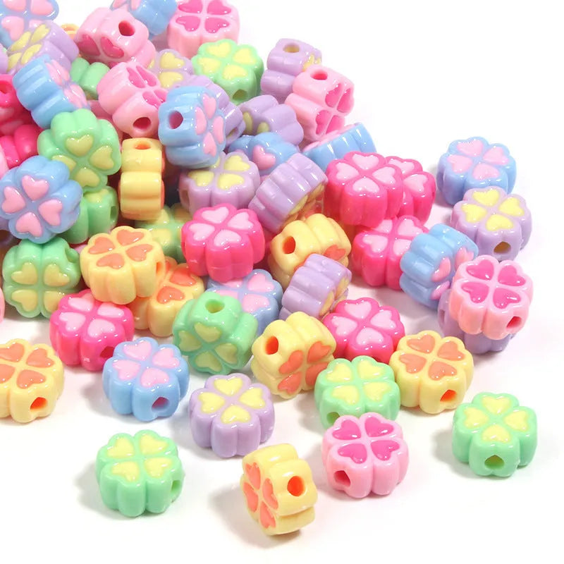 Assortment of 15mm frosted acrylic four-leaf clover beads in rose red, pink, yellow, green, blue, and purple colours.