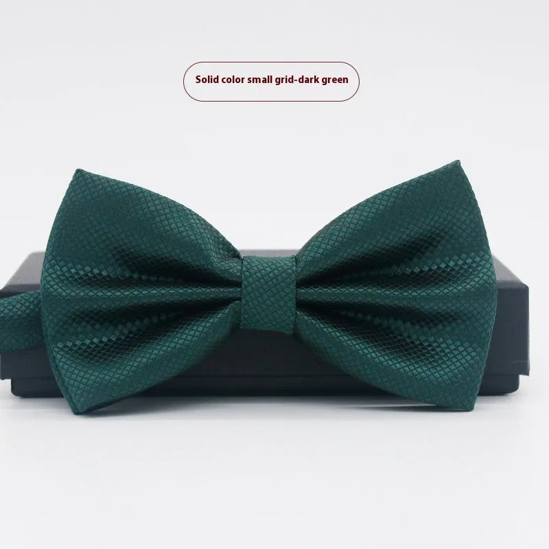 Solid colour polyester bow tie with flat head design measuring 12cm by 6cm