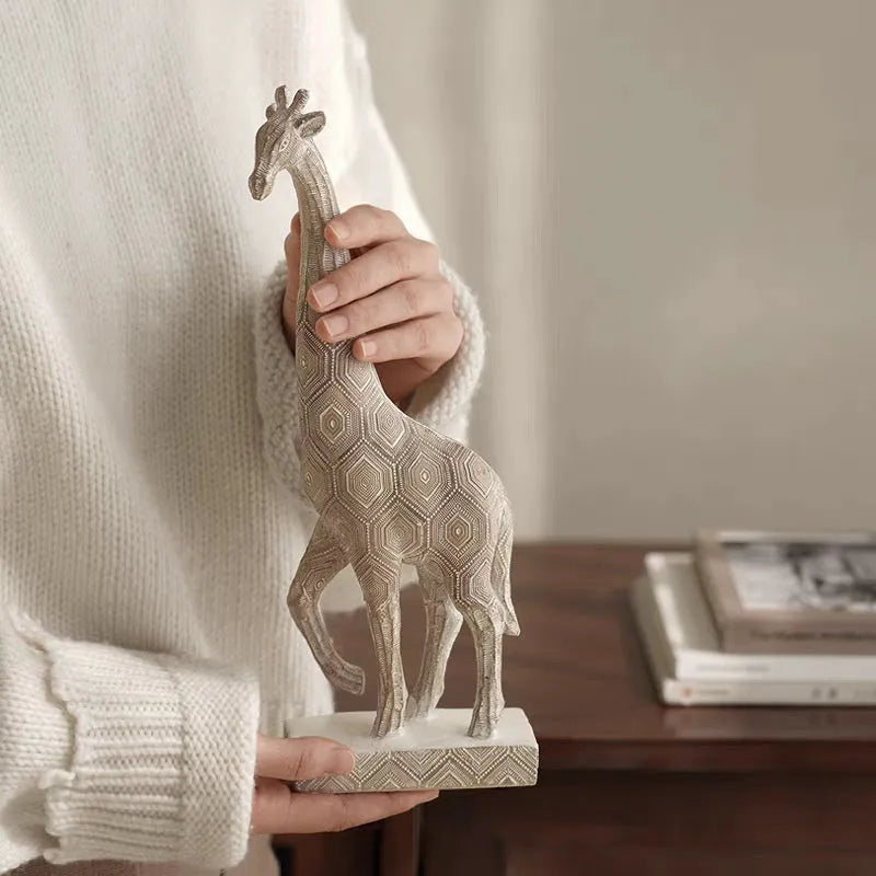 Wood colour synthetic resin giraffe ornament on a surface, showing European style and size scale.