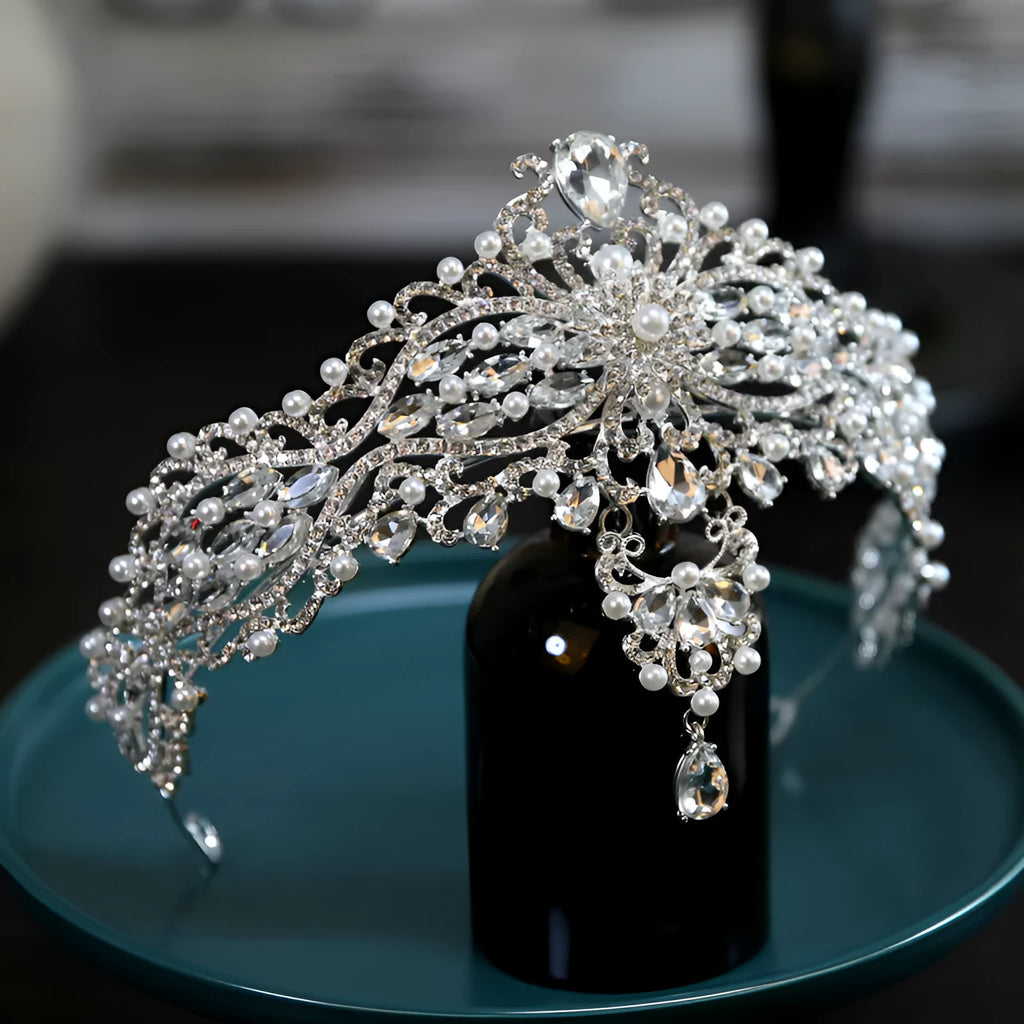 Silver alloy baroque bride crown with pearl and quota decoration on a white background